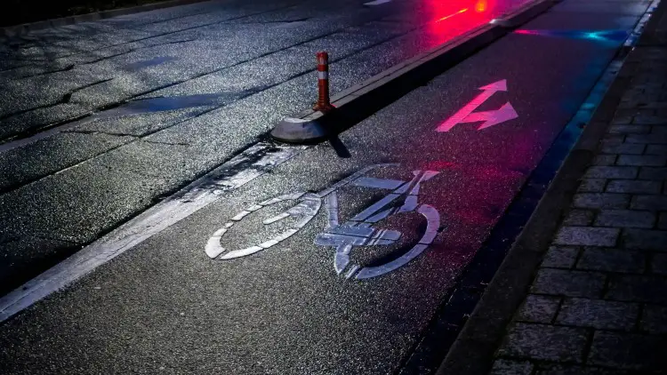 bicycle lane at night wet pavement